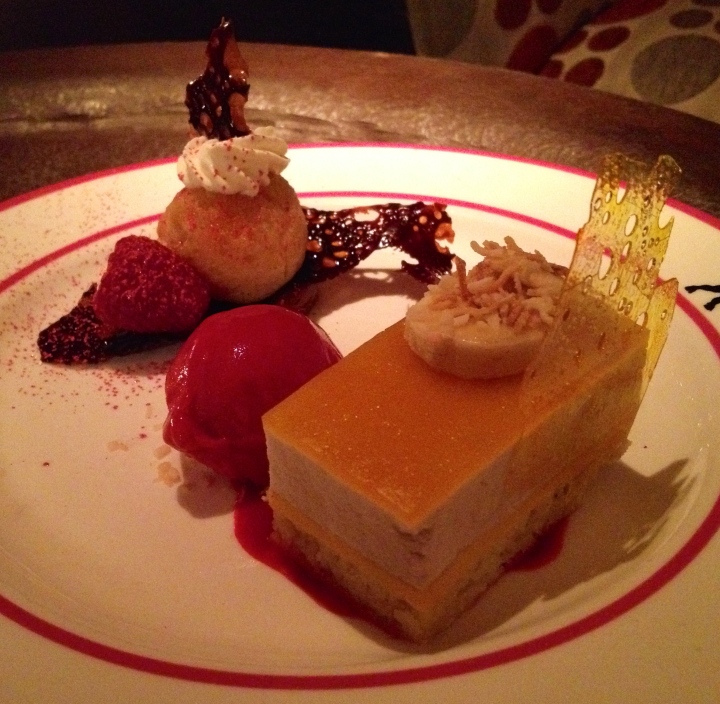 Dessert -- passion fruit layer cake, raspberry sorbet, liqueur-soaked cake with chocolate mousse underneath. 